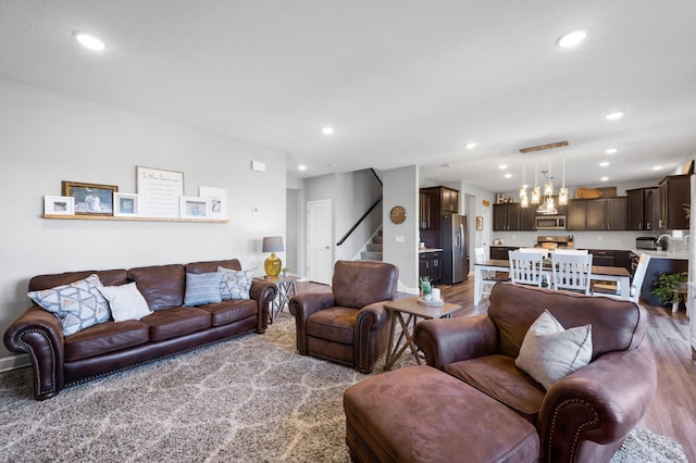 1126 Stonebridge Path, Jordan, MN 55352 - living area with stairway, recessed lighting, and wood finished floors