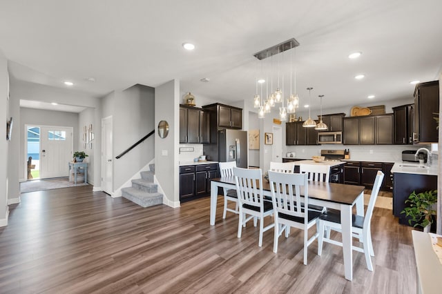1126 Stonebridge Path, Jordan, MN 55352 - dining area with wood finished floors, recessed lighting, stairway, and a chandelier