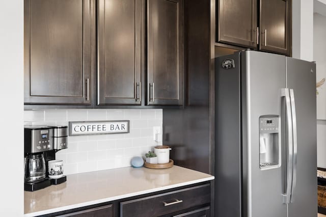 1126 Stonebridge Path, Jordan, MN 55352 - kitchen featuring stainless steel fridge, dark brown cabinetry, and tasteful backsplash