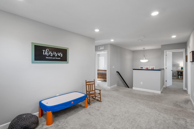 1126 Stonebridge Path, Jordan, MN 55352 - sitting room featuring an upstairs landing, recessed lighting, and carpet floors
