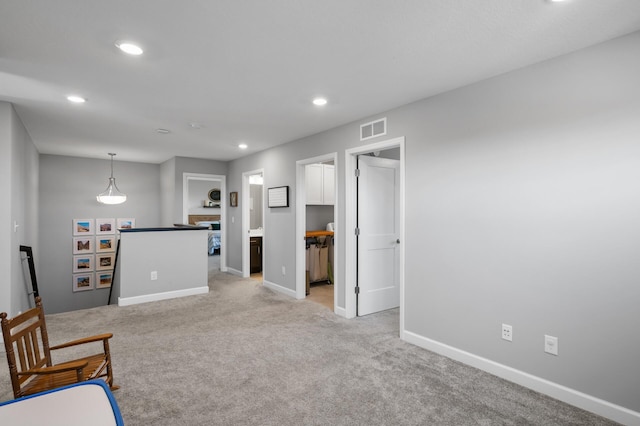 1126 Stonebridge Path, Jordan, MN 55352 - living area featuring light colored carpet, an upstairs landing, and recessed lighting