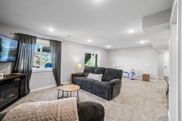1126 Stonebridge Path, Jordan, MN 55352 - carpeted living area with recessed lighting, plenty of natural light, and a textured ceiling