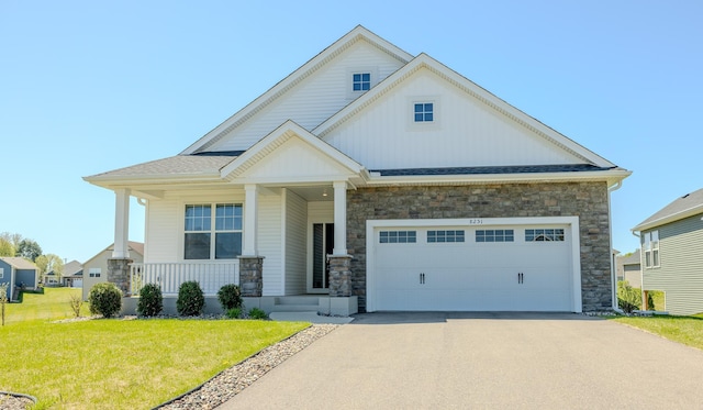 8251 62nd St, Bay South, Cottage Grove, MN 55016 - view of front facade featuring stone siding, concrete driveway, a front yard, a garage, and board and batten siding