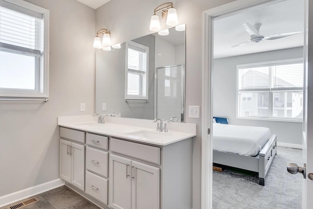 8251 62nd St, Bay South, Cottage Grove, MN 55016 - ensuite bathroom with plenty of natural light, double vanity, an enclosed shower, and ceiling fan