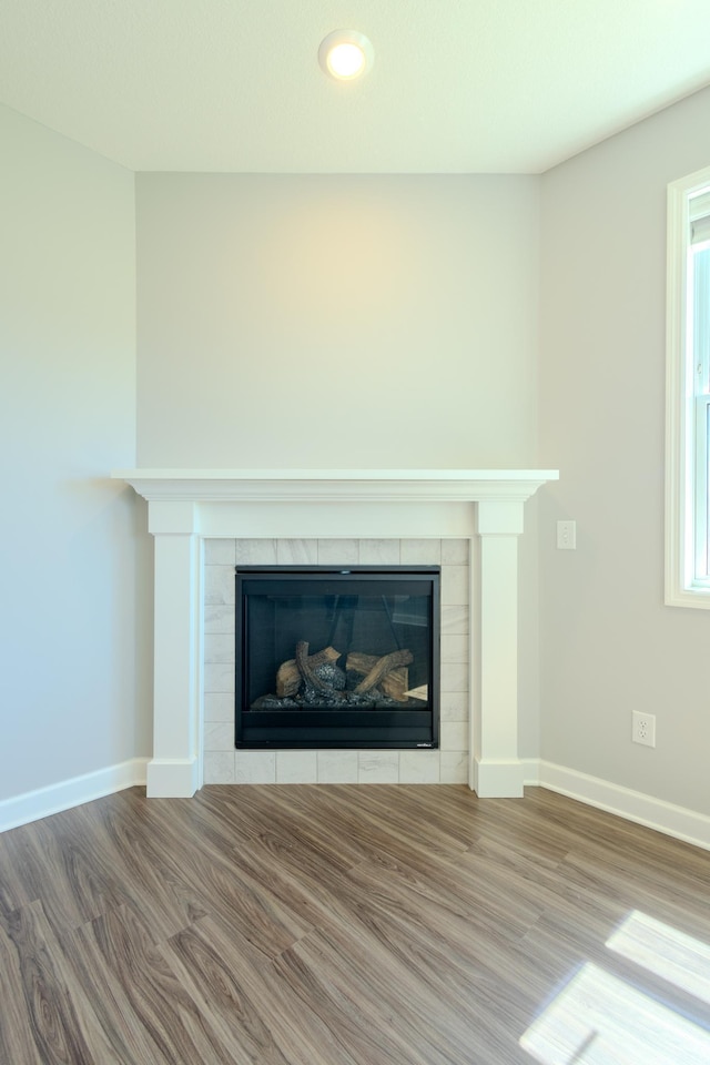 8251 62nd St, Bay South, Cottage Grove, MN 55016 - detailed view of a tile fireplace and wood finished floors