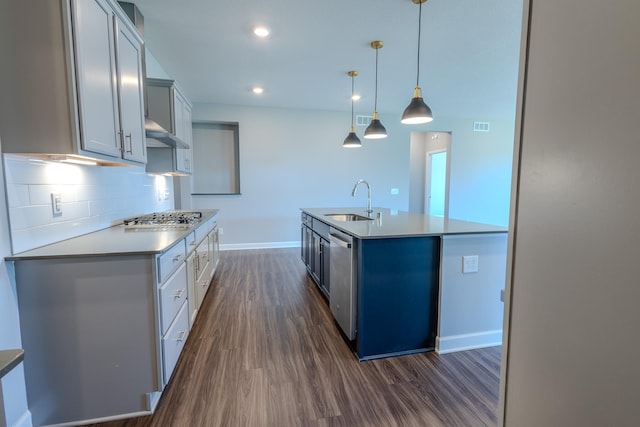 8251 62nd St, Bay South, Cottage Grove, MN 55016 - kitchen with appliances with stainless steel finishes, dark wood-type flooring, decorative backsplash, a kitchen island with sink, and recessed lighting