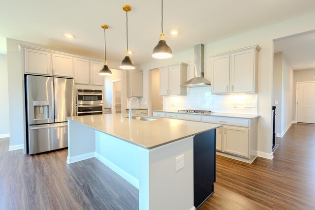 8251 62nd St, Bay South, Cottage Grove, MN 55016 - kitchen featuring stainless steel appliances, wall chimney range hood, dark wood-style floors, backsplash, and recessed lighting
