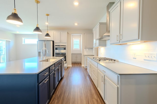8251 62nd St, Bay South, Cottage Grove, MN 55016 - kitchen featuring stainless steel appliances, light countertops, wood finished floors, backsplash, and decorative light fixtures