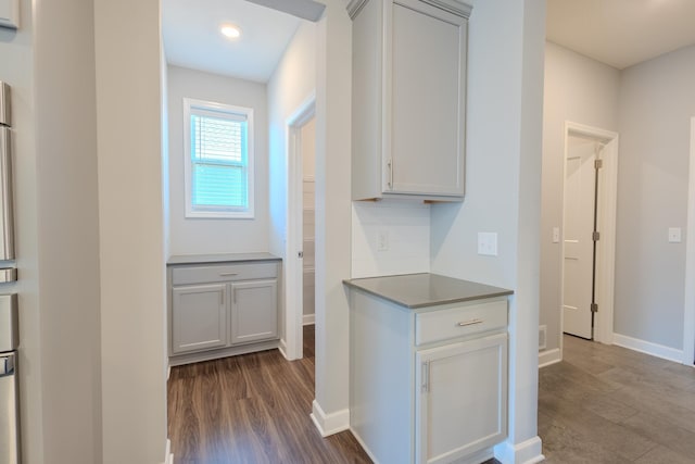 8251 62nd St, Bay South, Cottage Grove, MN 55016 - kitchen with dark wood-style floors and gray cabinetry