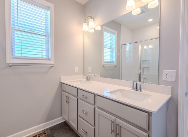 8251 62nd St, Bay South, Cottage Grove, MN 55016 - bathroom with double vanity and a stall shower