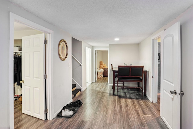 3825 2 1/2 St NE, Columbia Heights, MN 55421 - hallway featuring wood finished floors, a textured ceiling, stairway, and recessed lighting