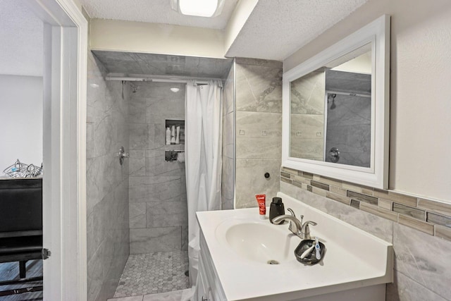 3825 2 1/2 St NE, Columbia Heights, MN 55421 - full bath with tile walls, a stall shower, vanity, and a textured ceiling