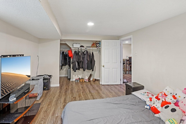 3825 2 1/2 St NE, Columbia Heights, MN 55421 - bedroom featuring wood finished floors, a closet, and recessed lighting