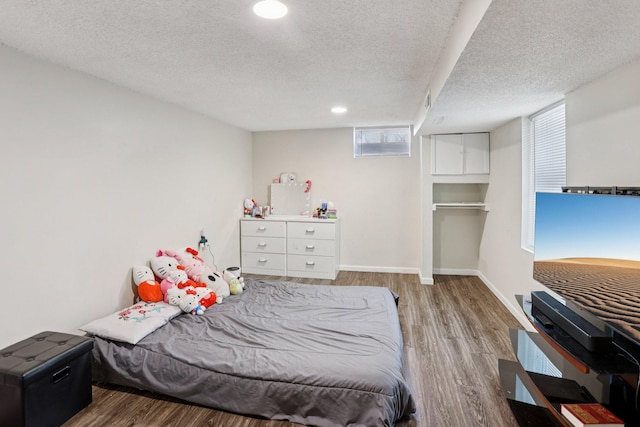 3825 2 1/2 St NE, Columbia Heights, MN 55421 - bedroom with wood finished floors, a textured ceiling, multiple windows, and recessed lighting