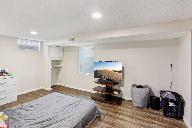 3825 2 1/2 St NE, Columbia Heights, MN 55421 - bedroom with a textured ceiling, wood finished floors, and recessed lighting