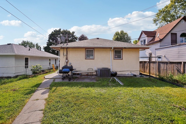 3825 2 1/2 St NE, Columbia Heights, MN 55421 - back of property with stucco siding, a fenced backyard, and a patio