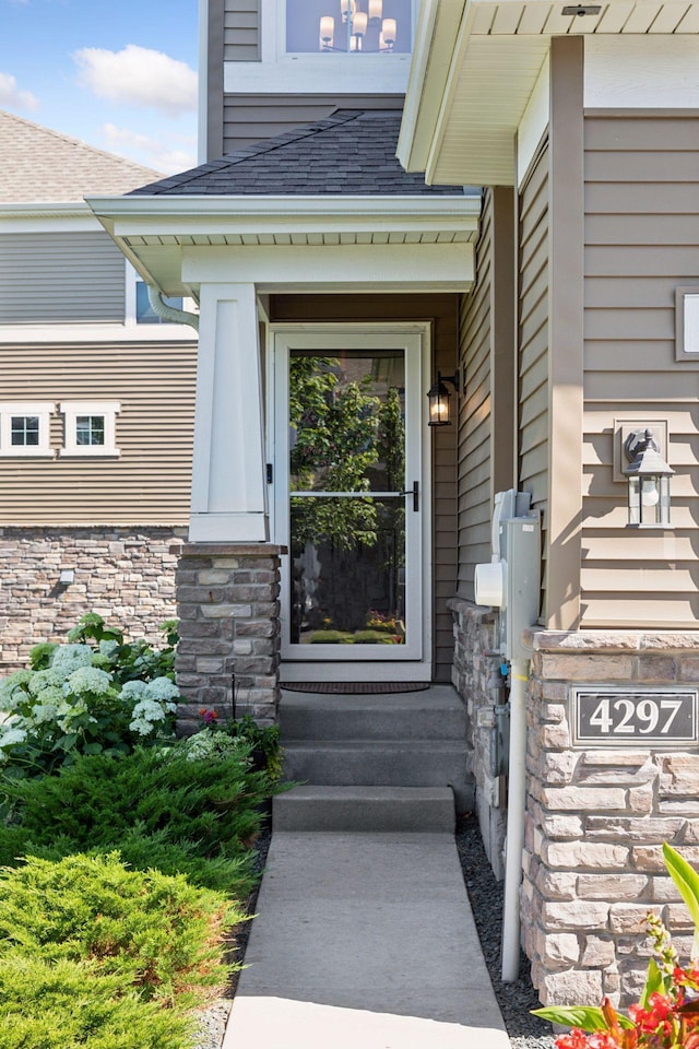 4297 Corn Silk Ln, Woodbury, MN 55129 - doorway to property with a shingled roof