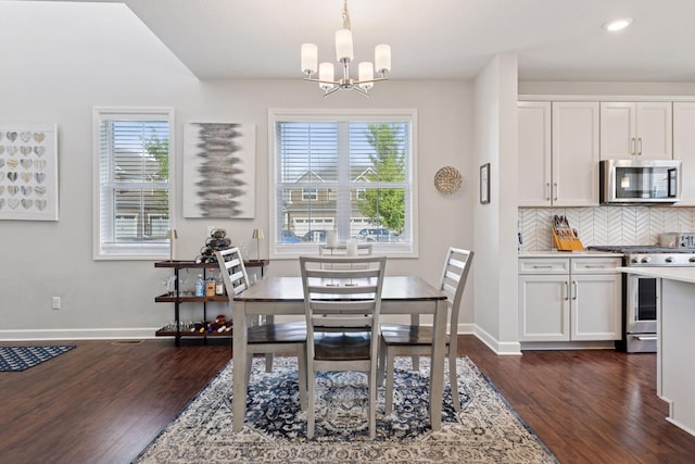 4297 Corn Silk Ln, Woodbury, MN 55129 - dining space with healthy amount of natural light, a chandelier, dark wood finished floors, and recessed lighting