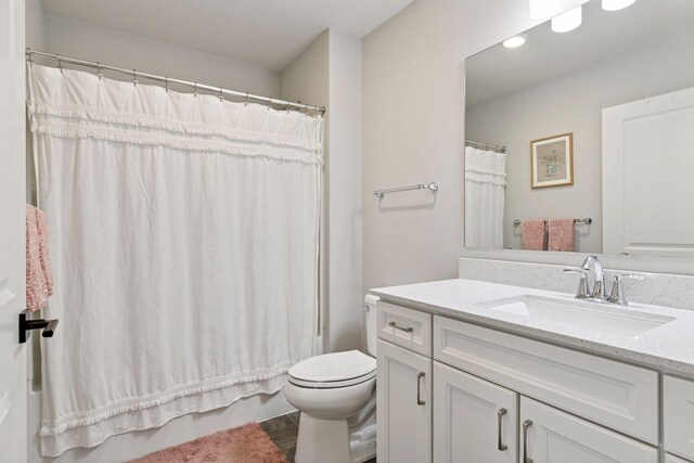 4297 Corn Silk Ln, Woodbury, MN 55129 - full bathroom featuring vanity, recessed lighting, shower / bathtub combination with curtain, and wood finished floors