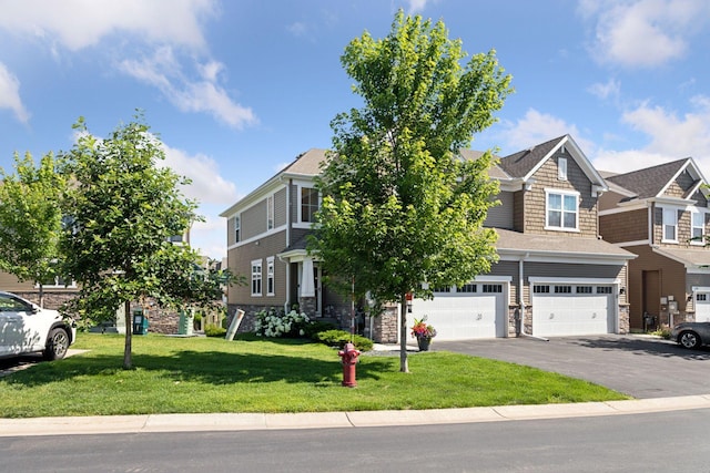 4297 Corn Silk Ln, Woodbury, MN 55129 - view of front of home with stone siding, a garage, driveway, and a front lawn