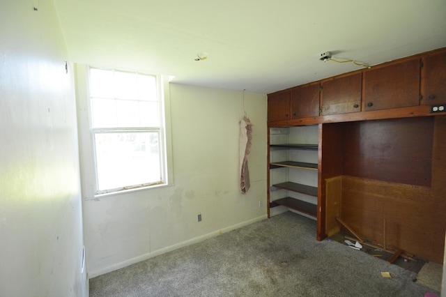 506 3rd Ave NW, Dodge Center, MN 55927 - unfurnished bedroom featuring carpet flooring and baseboards