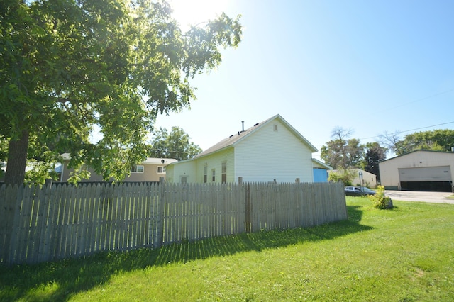 506 3rd Ave NW, Dodge Center, MN 55927 - view of home's exterior featuring a detached garage