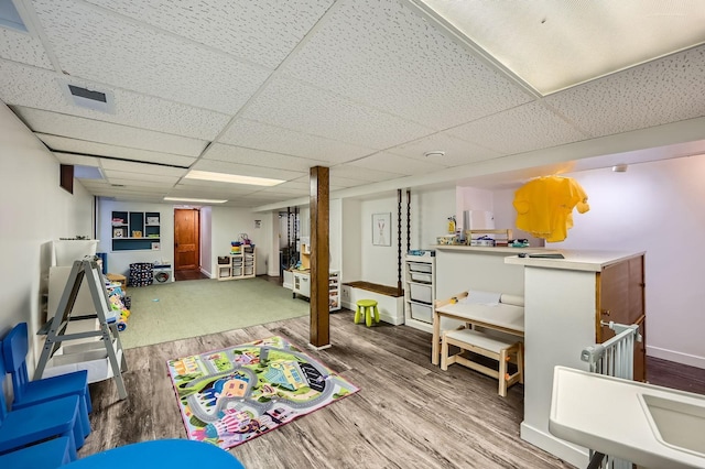 1268 Stanford Ave, Saint Paul, MN 55105 - recreation room featuring wood finished floors and a drop ceiling