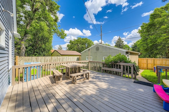 1268 Stanford Ave, Saint Paul, MN 55105 - wooden deck featuring outdoor dining space and a fenced backyard