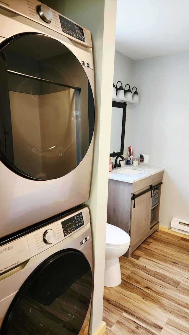 315 Woodworth St, Elmwood, WI 54740 - laundry room with estacked washer and dryer and light wood-type flooring