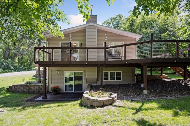 2010 Kestrel Trl, Buffalo, MN 55313 - rear view of property featuring a yard, a deck, a chimney, and stairway