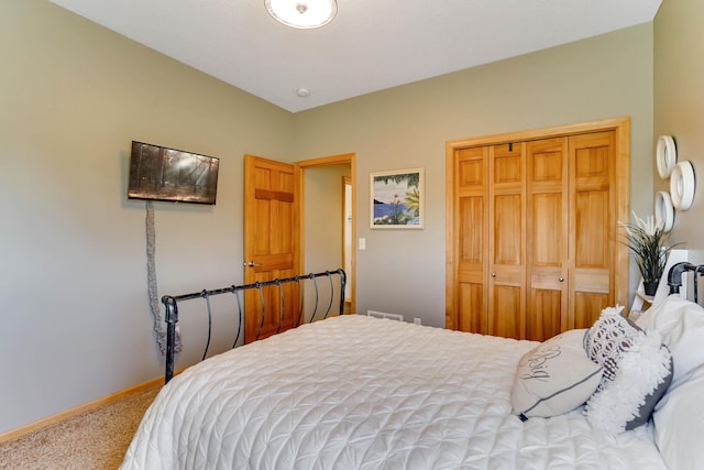 2064 141st Ln NE, Ham Lake, MN 55304 - carpeted bedroom featuring a closet and baseboards