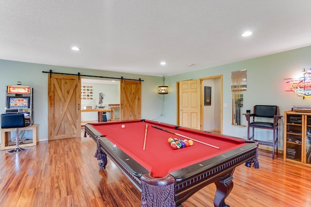 2064 141st Ln NE, Ham Lake, MN 55304 - game room featuring a barn door, wood finished floors, recessed lighting, and pool table