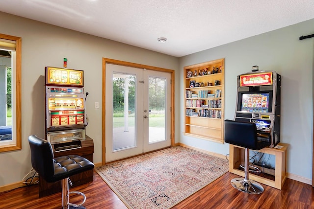 2064 141st Ln NE, Ham Lake, MN 55304 - office featuring french doors, dark wood-style flooring, and a textured ceiling