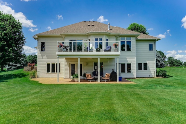 2064 141st Ln NE, Ham Lake, MN 55304 - rear view of property with a patio area, a lawn, and a balcony