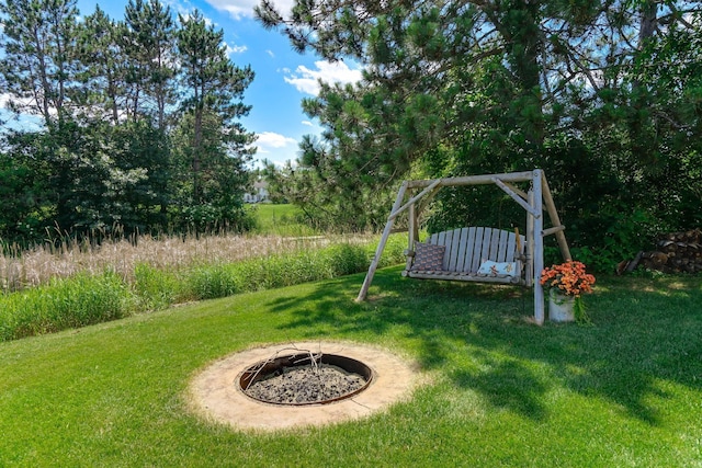 2064 141st Ln NE, Ham Lake, MN 55304 - view of green lawn featuring a fire pit