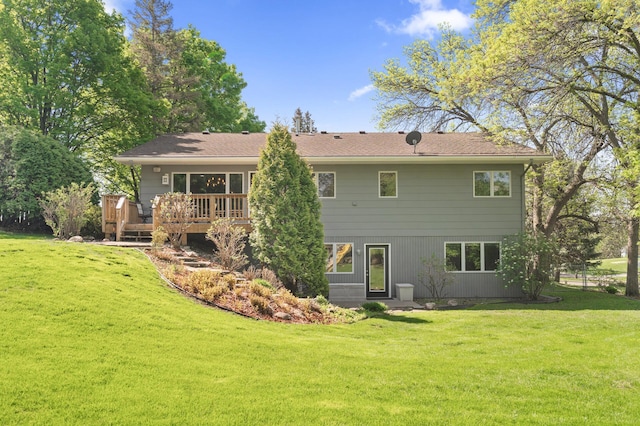 9610 28th Ave N, Plymouth, MN 55441 - rear view of property featuring a deck and a lawn