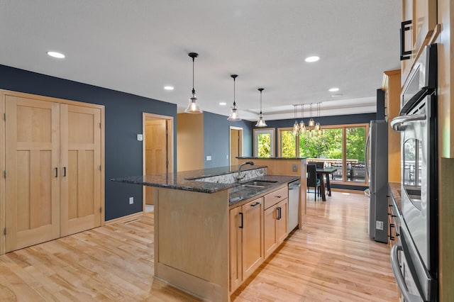 9610 28th Ave N, Plymouth, MN 55441 - kitchen featuring a kitchen island with sink, light wood finished floors, appliances with stainless steel finishes, recessed lighting, and light brown cabinetry