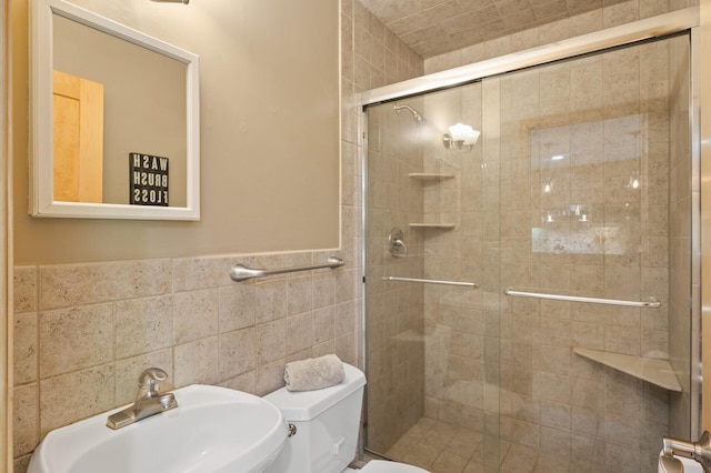 9610 28th Ave N, Plymouth, MN 55441 - bathroom featuring a shower stall, tile walls, and a wainscoted wall