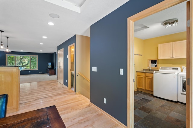 9610 28th Ave N, Plymouth, MN 55441 - corridor featuring washing machine and clothes dryer, recessed lighting, and an upstairs landing