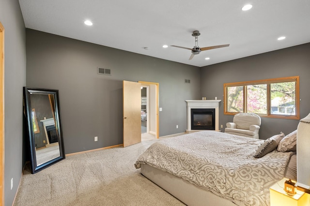 9610 28th Ave N, Plymouth, MN 55441 - carpeted bedroom with a glass covered fireplace, recessed lighting, and a ceiling fan