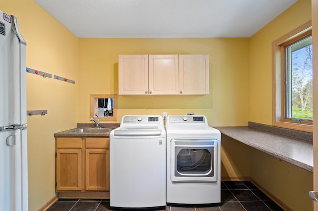 9610 28th Ave N, Plymouth, MN 55441 - washroom with cabinet space, washer and dryer, and dark tile patterned flooring