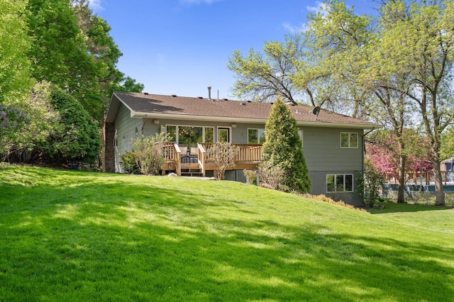 9610 28th Ave N, Plymouth, MN 55441 - rear view of house featuring a deck and a lawn