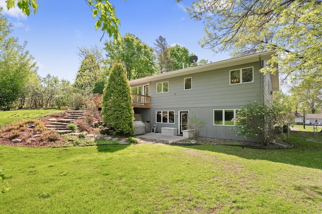 9610 28th Ave N, Plymouth, MN 55441 - back of house featuring a patio, a yard, and a wooden deck