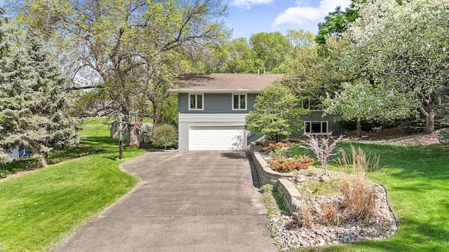 9610 28th Ave N, Plymouth, MN 55441 - view of front of home featuring asphalt driveway, a garage, and a front yard