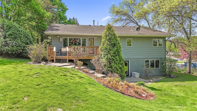 9610 28th Ave N, Plymouth, MN 55441 - rear view of house featuring a deck and a lawn