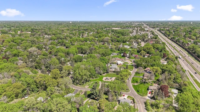 9610 28th Ave N, Plymouth, MN 55441 - aerial view of property's location featuring a major roadway and a heavily wooded area