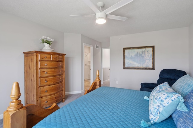 10888 Territorial Trl, Dayton, MN 55369 - carpeted bedroom with ceiling fan, ensuite bath, and a textured ceiling