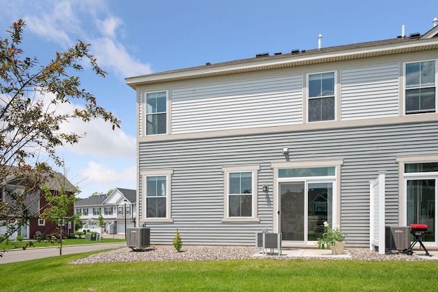 10888 Territorial Trl, Dayton, MN 55369 - back of house featuring a lawn