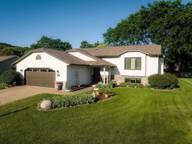 2711 Cedar Ave, Holmen, WI 54636 - tri-level home with an attached garage, a front lawn, driveway, and roof with shingles