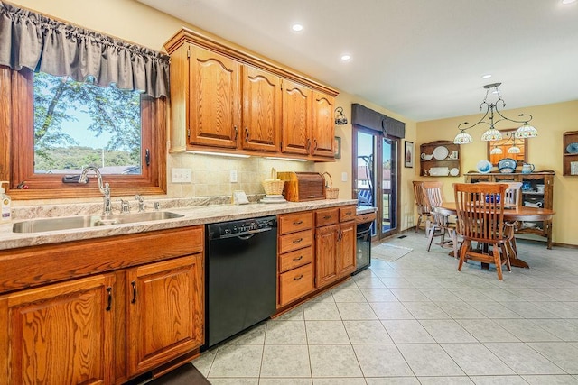 2711 Cedar Ave, Holmen, WI 54636 - kitchen with dishwasher, light countertops, brown cabinetry, and recessed lighting